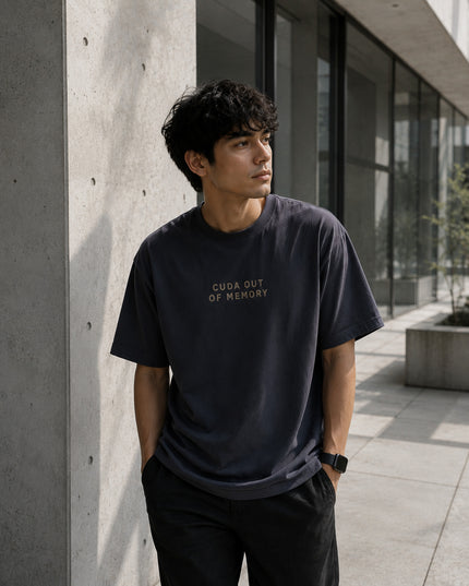 Male model wearing the Shevelo Cuda out of memory heavyweight oversized tee in Faded Black.