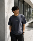 Male model wearing the Shevelo Context overflow heavyweight oversized tee in Faded indigo.