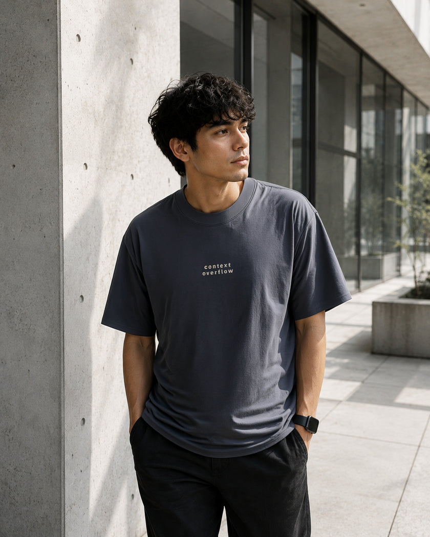 Male model wearing the Shevelo Context overflow heavyweight oversized tee in Faded indigo.
