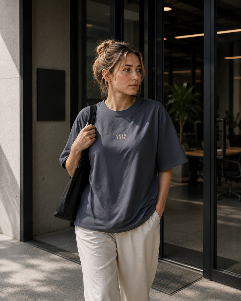 Feale model wearing the Shevelo Token limit heavyweight oversized tee in Faded indigo.