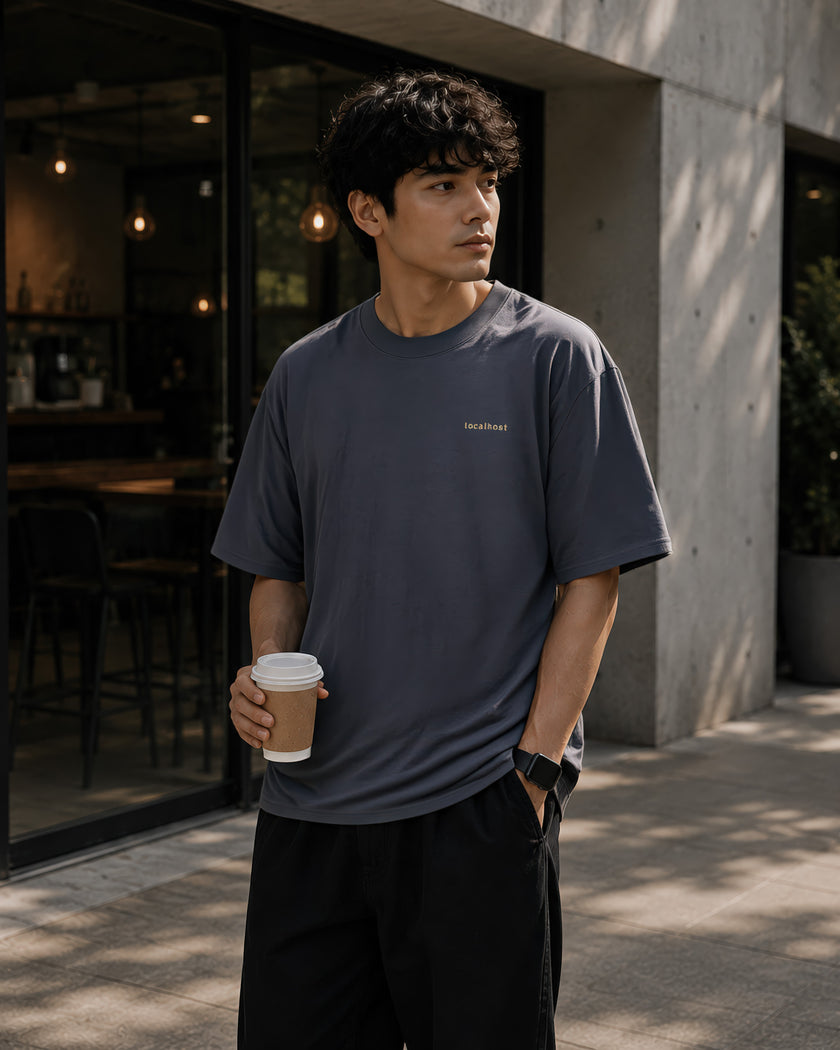Male model wearing the Shevelo Localhost heavyweight oversized tee in Indigo.