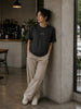 Female model wearing the Shevelo Context overflow heavyweight oversized tee in Faded black.