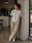 Female model wearing the Shevelo Context overflow heavyweight oversized tee in Bone.