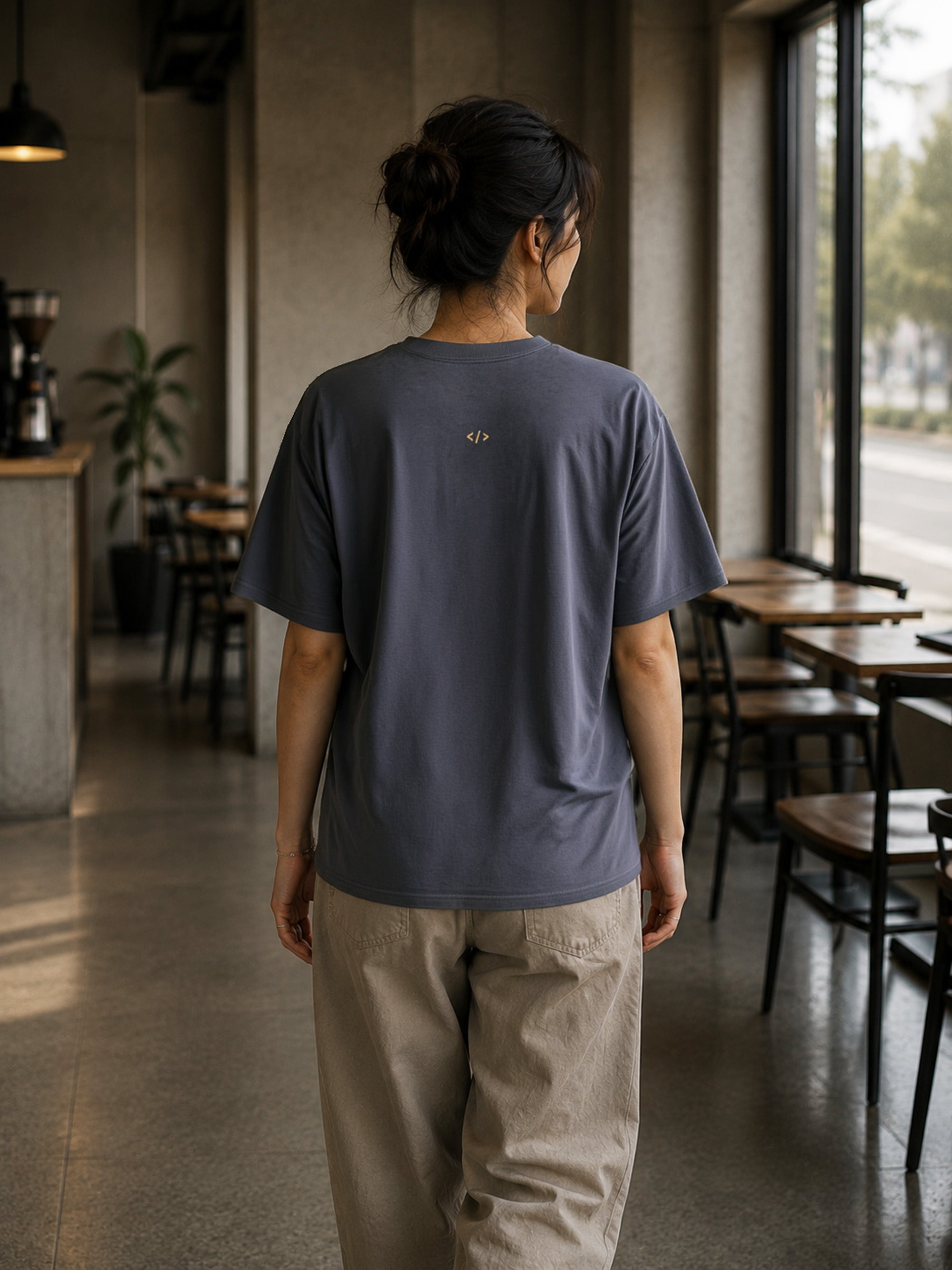 Rear view of the Shevelo Token limit heavyweight oversized tee in Faded indigo showing the signature back graphic.